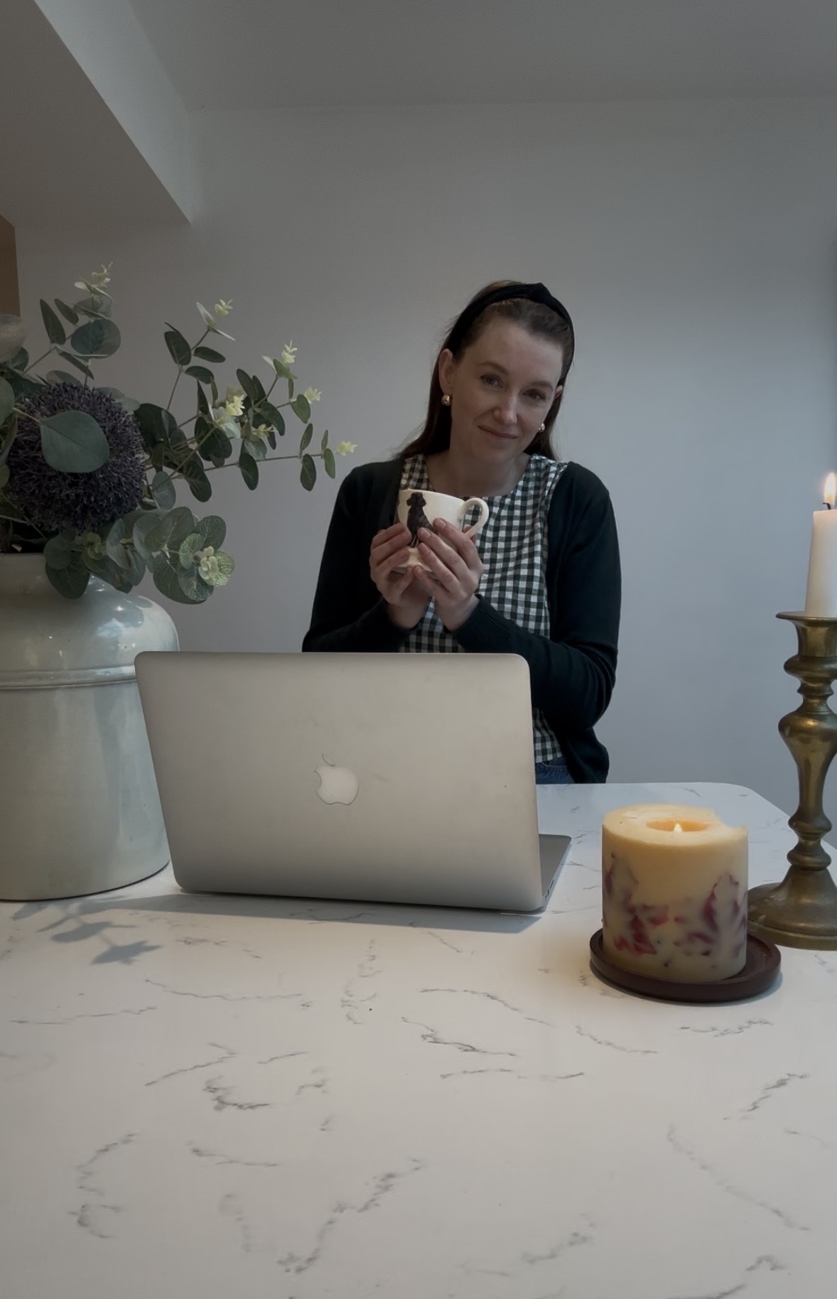 Kat Sanders at her laptop, planning her content